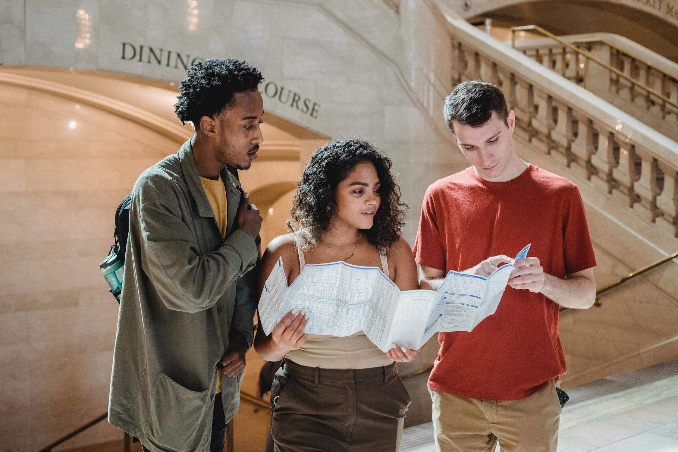 Three friends looking at a map